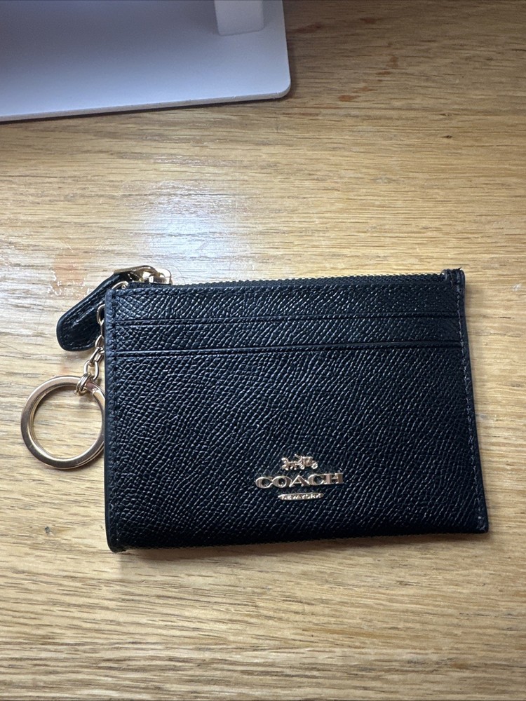 Black and gold Coach leather card holder