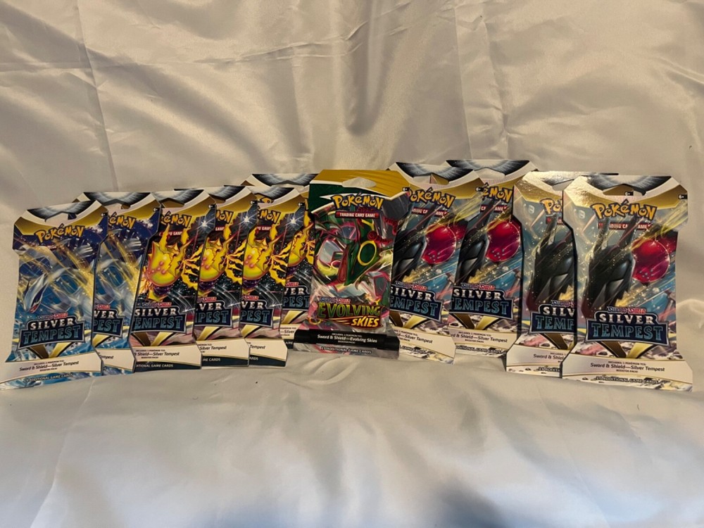11 pokemon sleeved booster packs including 1 Evolvong Skies