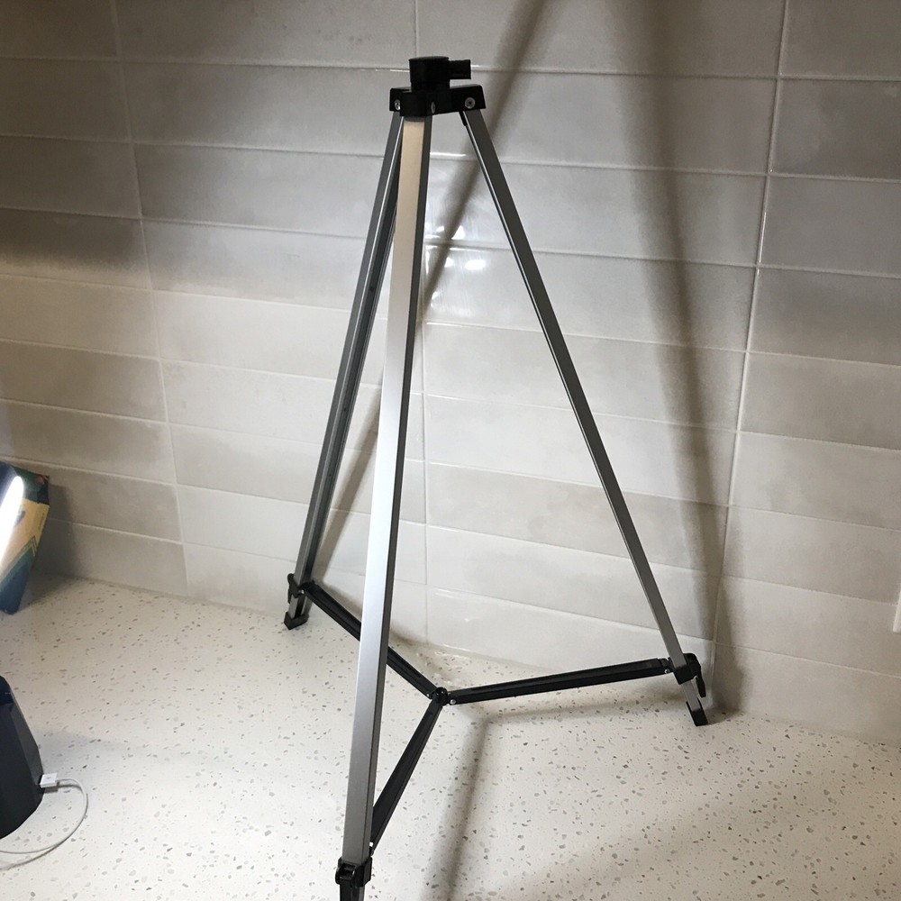 A Tripod, Not Sure What For Probably A Camera Tripod Silver Two Levels 4ft