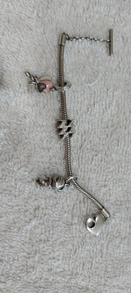 Pandora bracelet with pre-owned charms available now-image