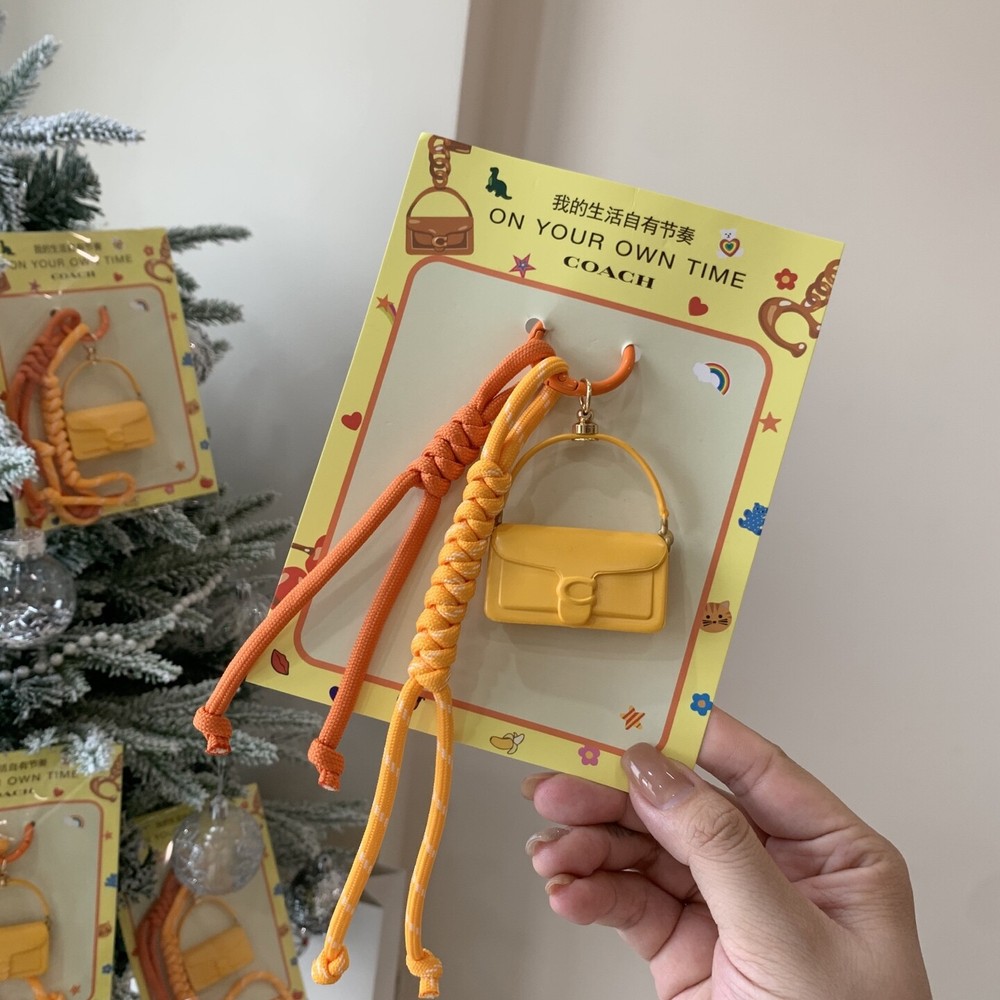 2025 Coach Yellow Tabby Lunar Bag Charm with Red Keychain