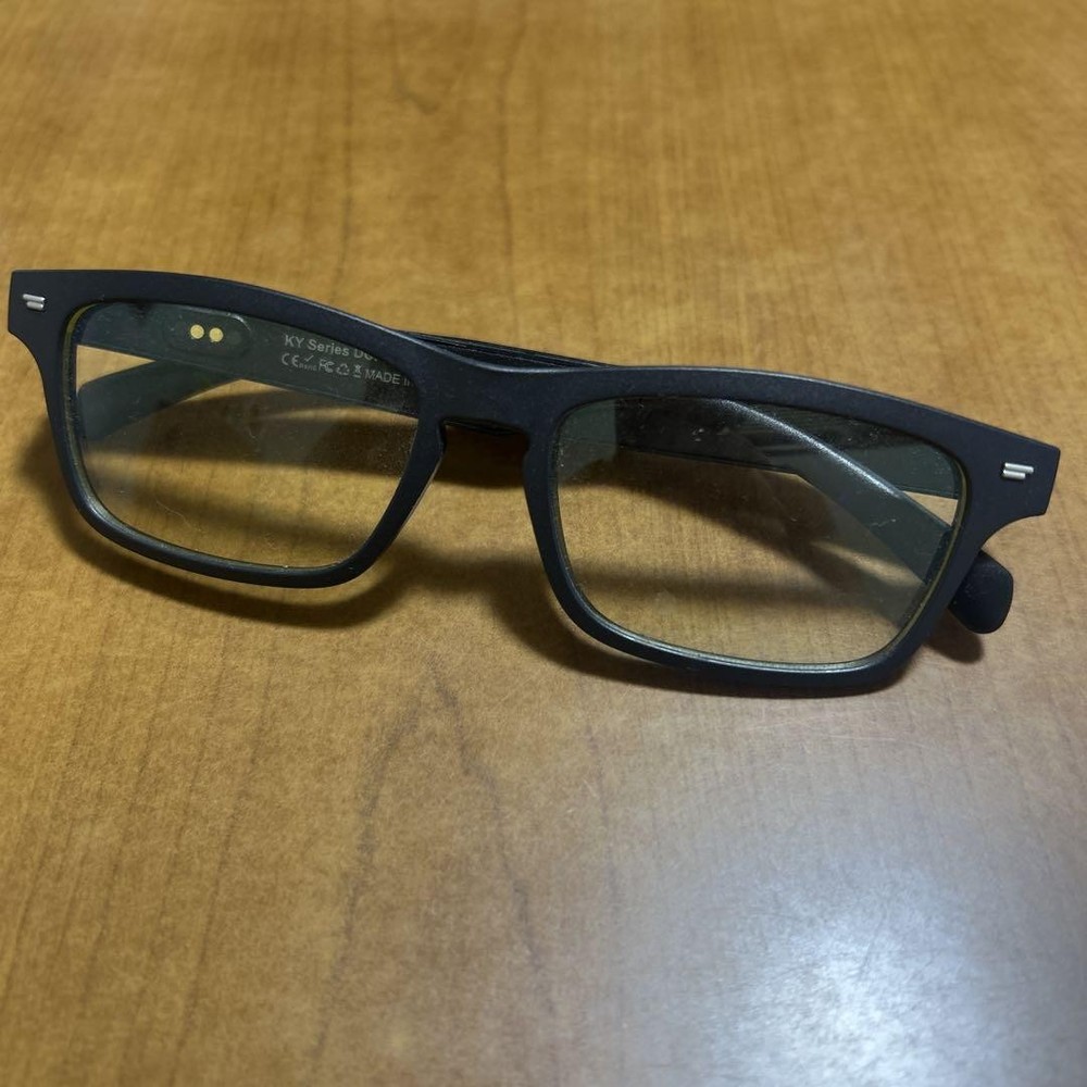 Smart glasses with AI features and USB charging cable