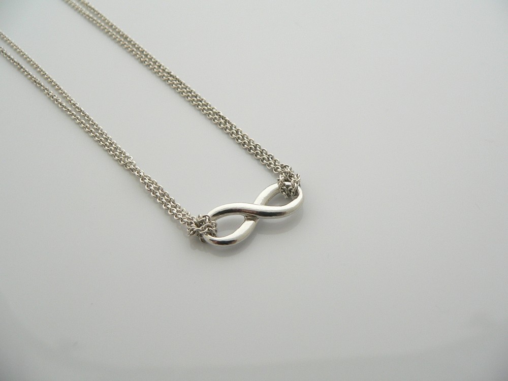 Tiffany & Co Silver Infinity Double Chain Pendant Necklace Symbolizing Love and Perfect for Gifting