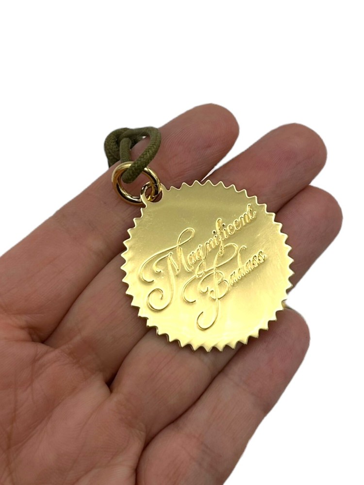 INDIA HICKS 'Magnificent Badass' Charm Token Pendant Green Cord Necklace