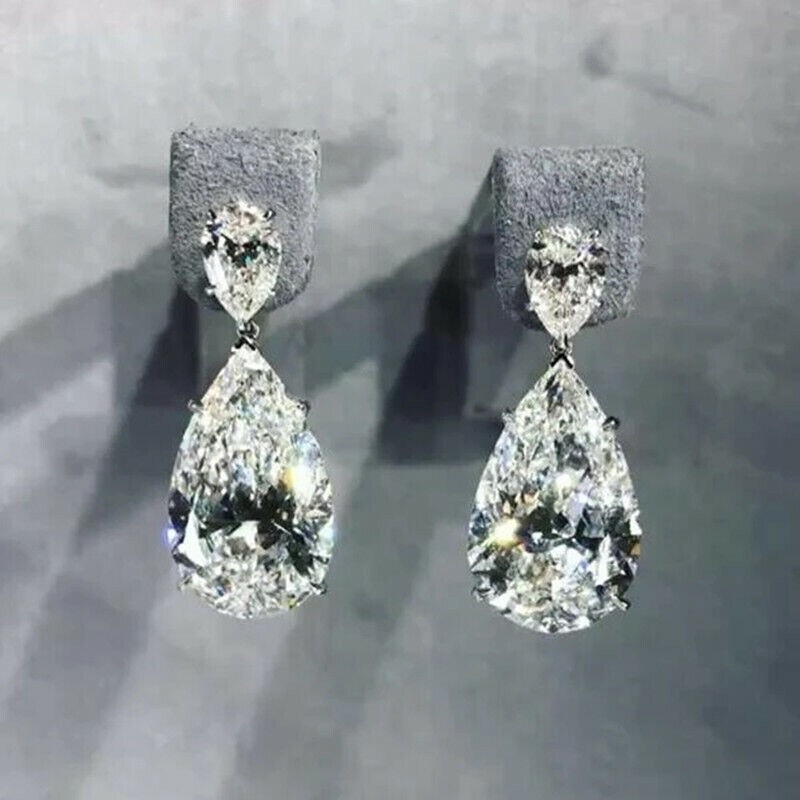 Glistening Pear Simulated Diamond Teardrop Earrings in 14k White Gold Plated Finish