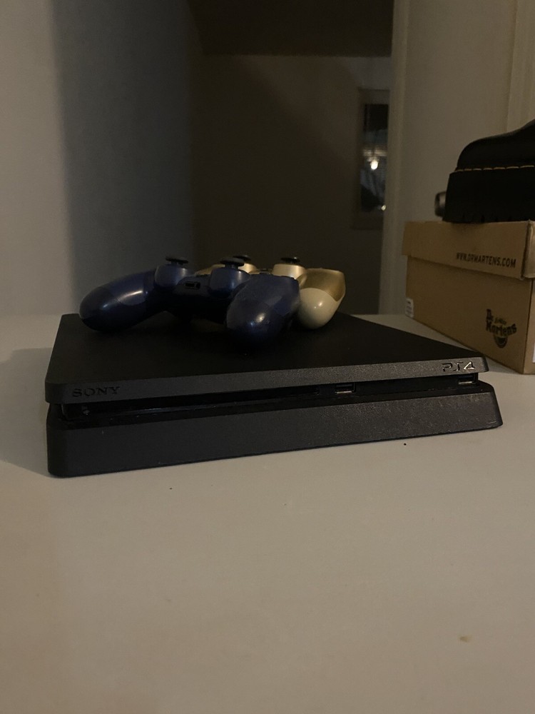 Sony PlayStation 4 Pro 1TB Gaming Console - Powerful 4K HDR Gaming Performance in Sleek Black Design