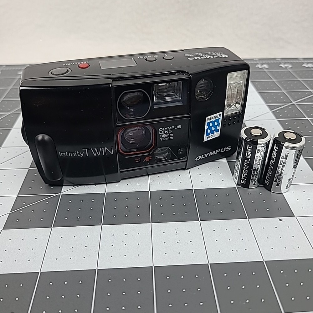 Olympus Infinity Twin Lens 35mm 70mm Film Camera with Weatherproof Design and Working Battery