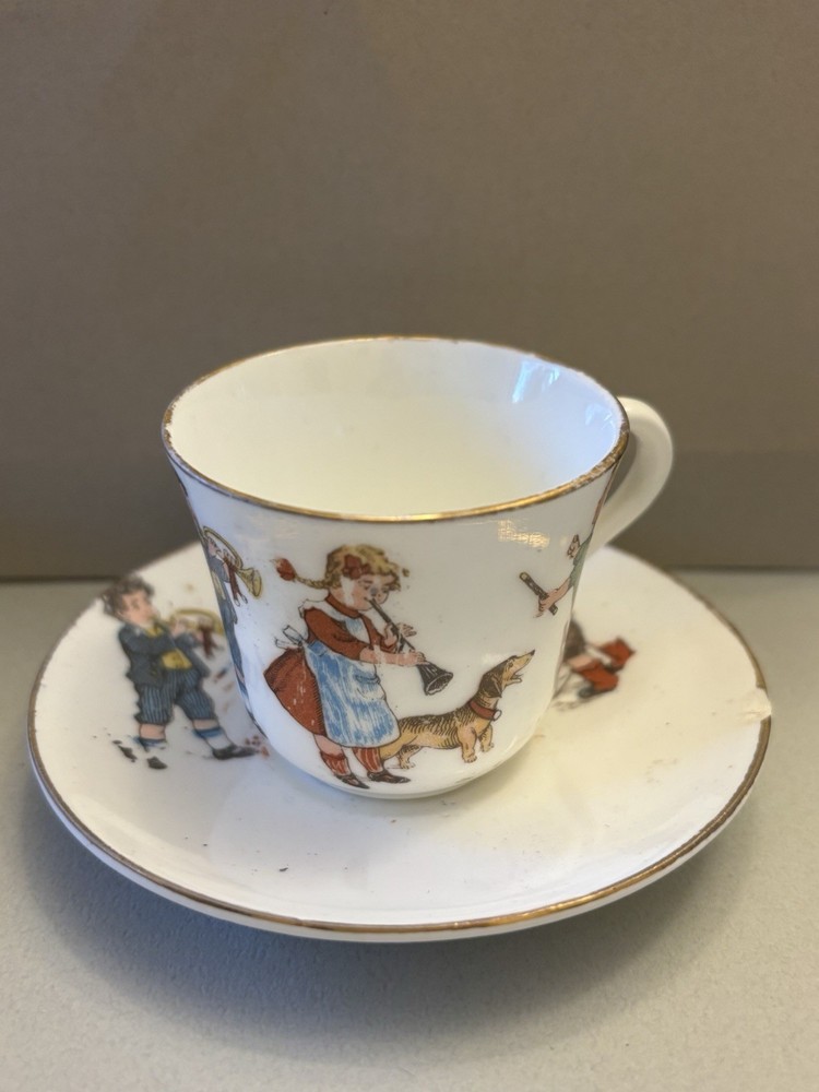 Cup and Saucer with Children Playing Instruments Vintage