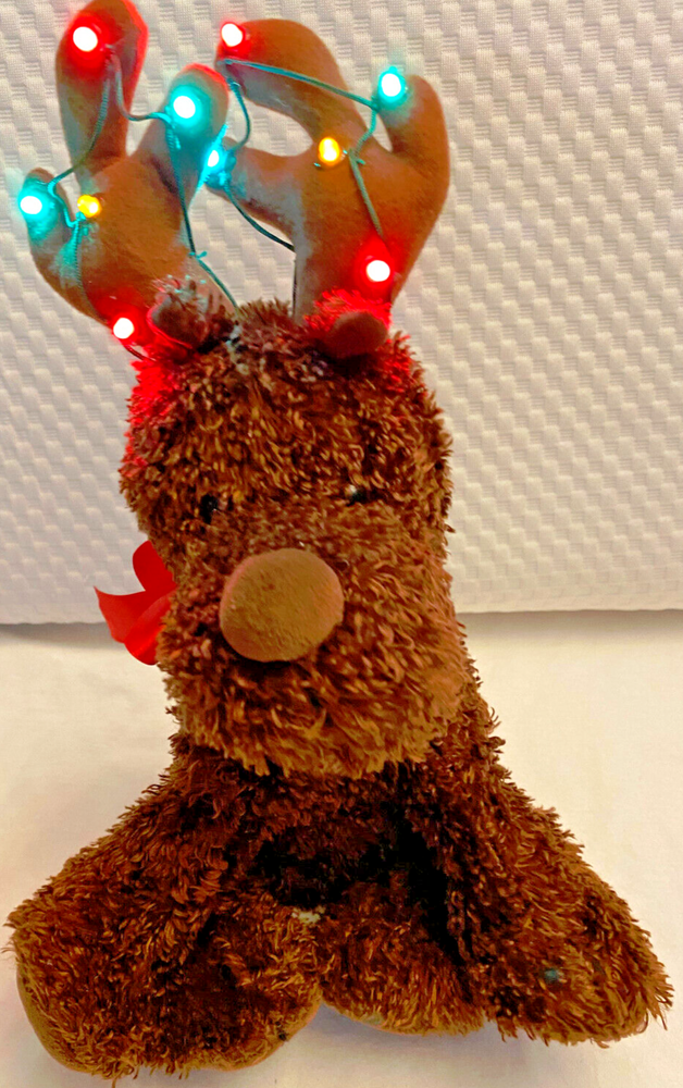 Christmas Reindeer with light up antelers plush. Sings jingles bells, head moves