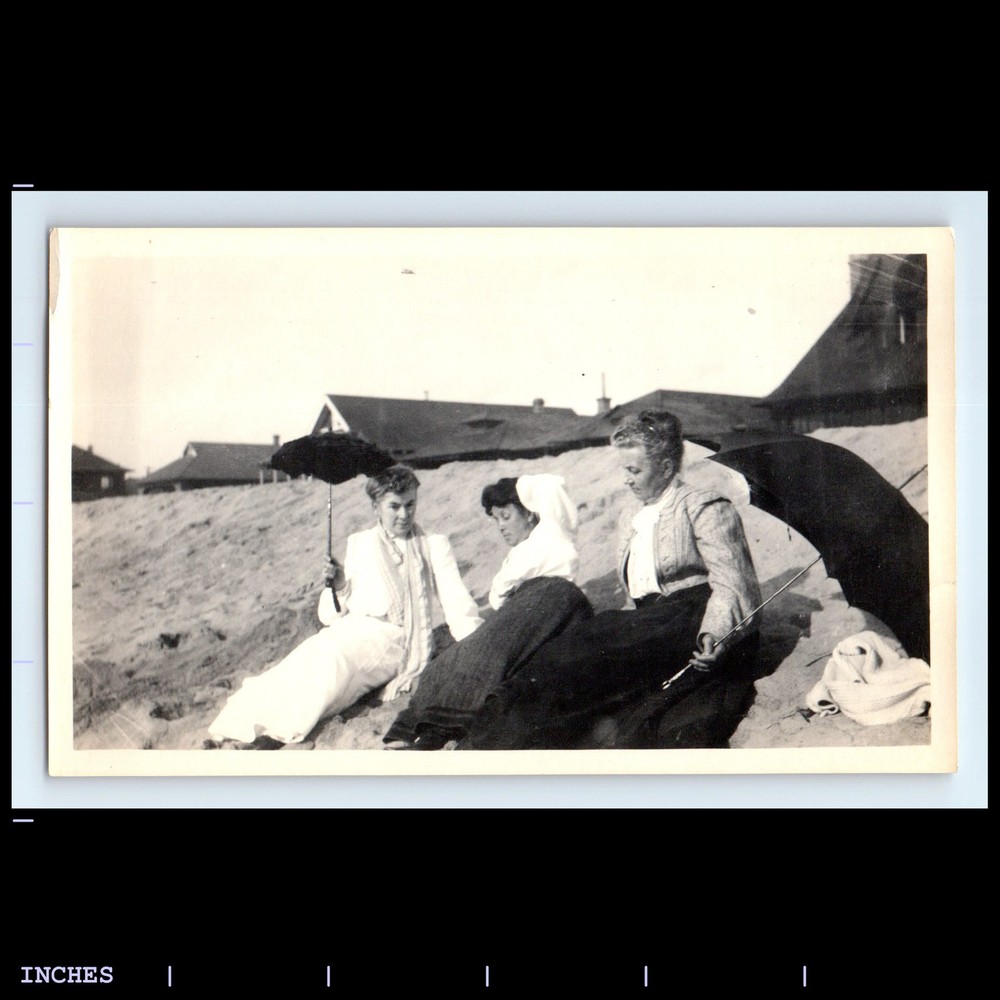 Victorian era women at beach holding parasols vintage photo