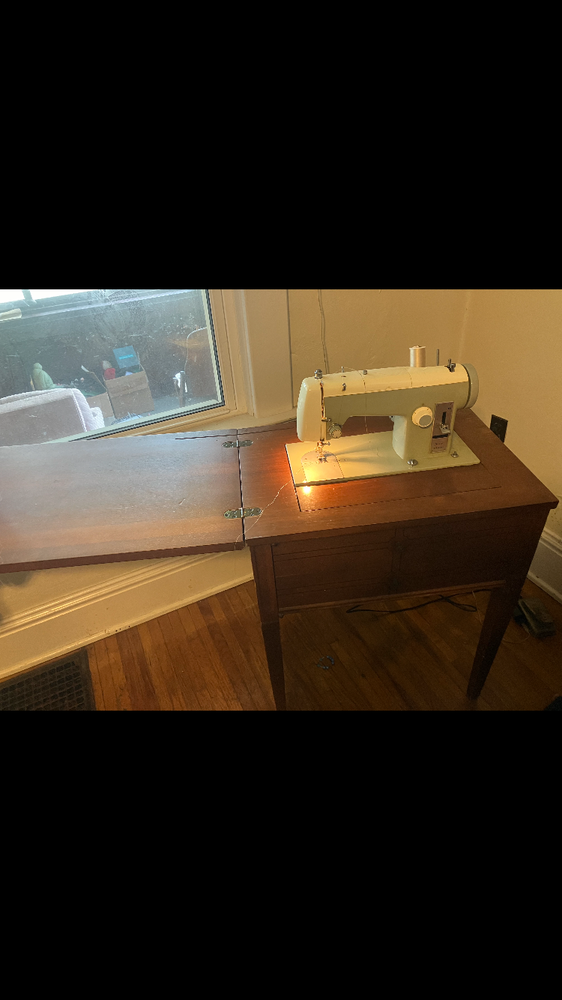 Compact sewing machine with built-in storage space