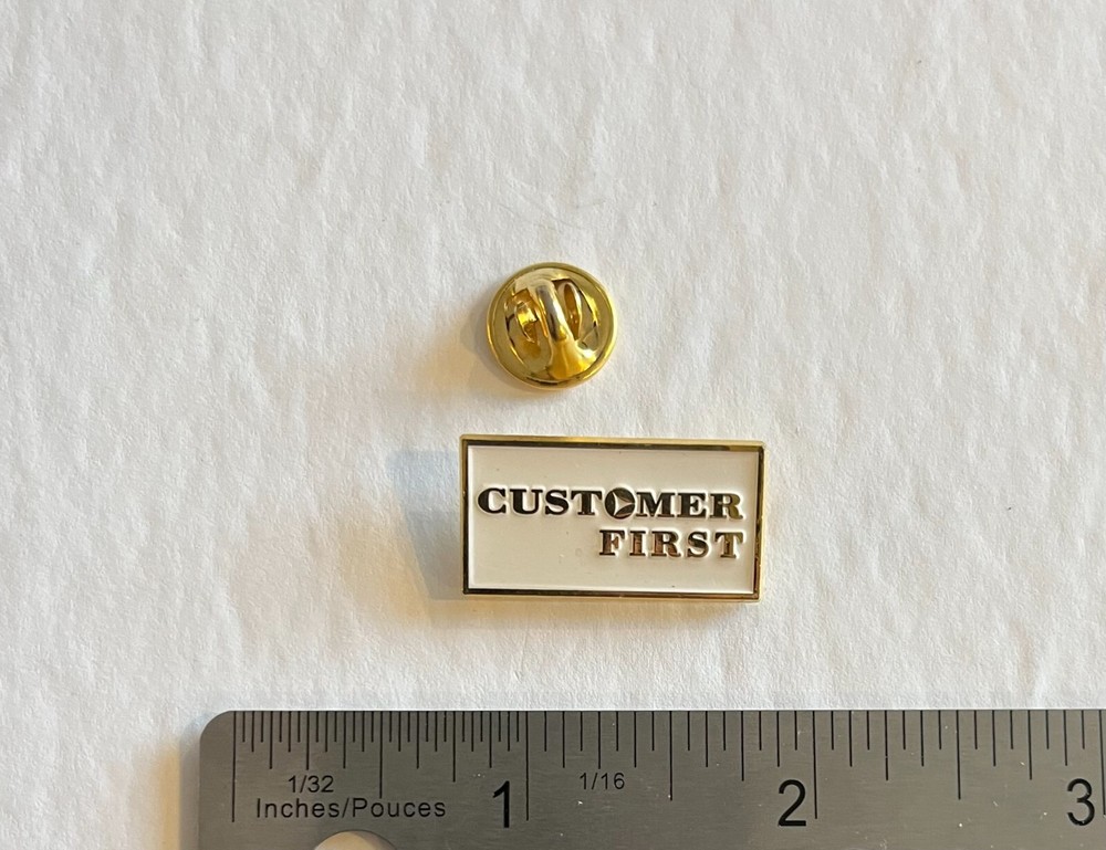 Customer First - Small White & Gold Colored Collector Pin-image
