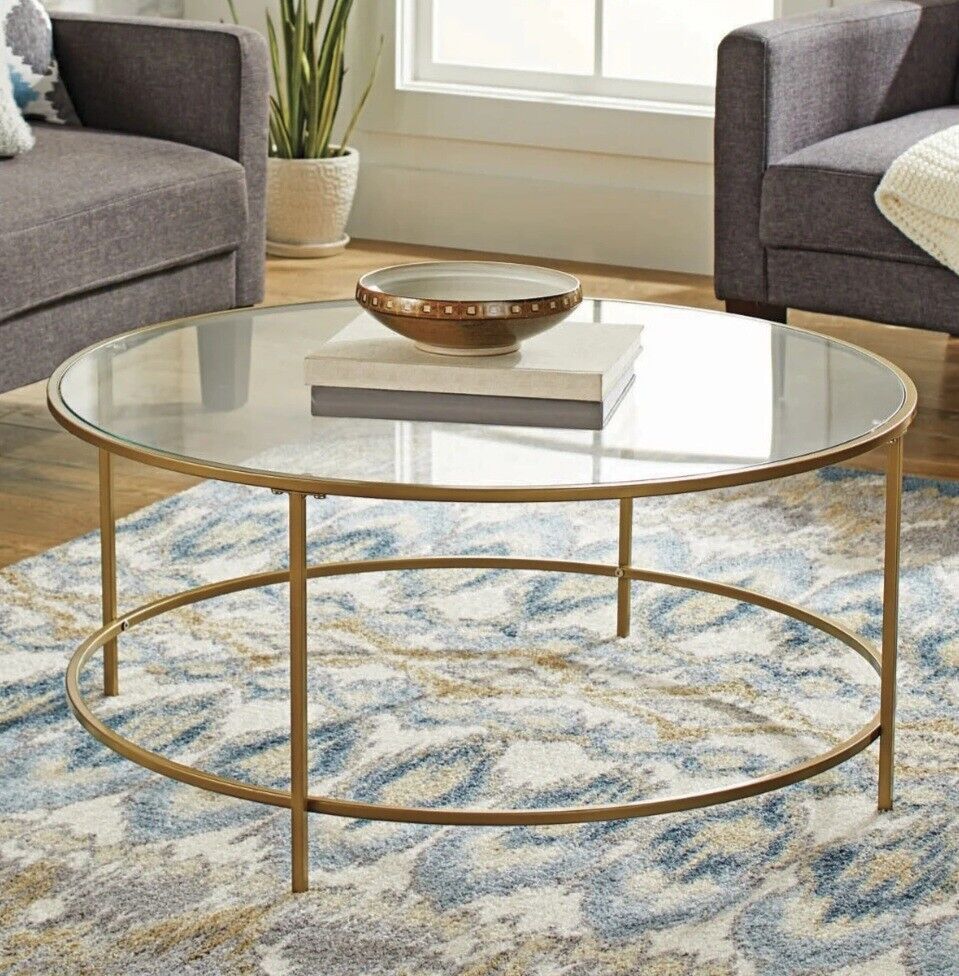 Better Homes & Garden Nola Coffee Table features a gold finish and modern desige