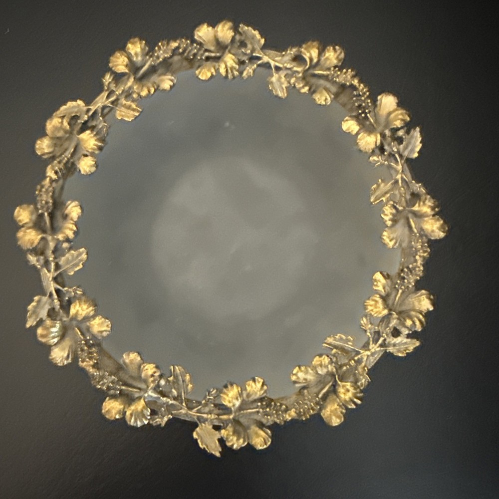 Antique Frosted Round Dish Wth Flowers And Leafs Decorating All Around it.