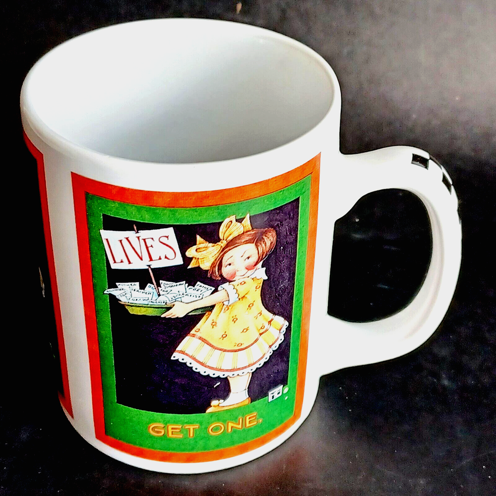 Mary Engelbreit Lives Get One Coffee Tea Mug Cup Black Red Green Handle NIB
