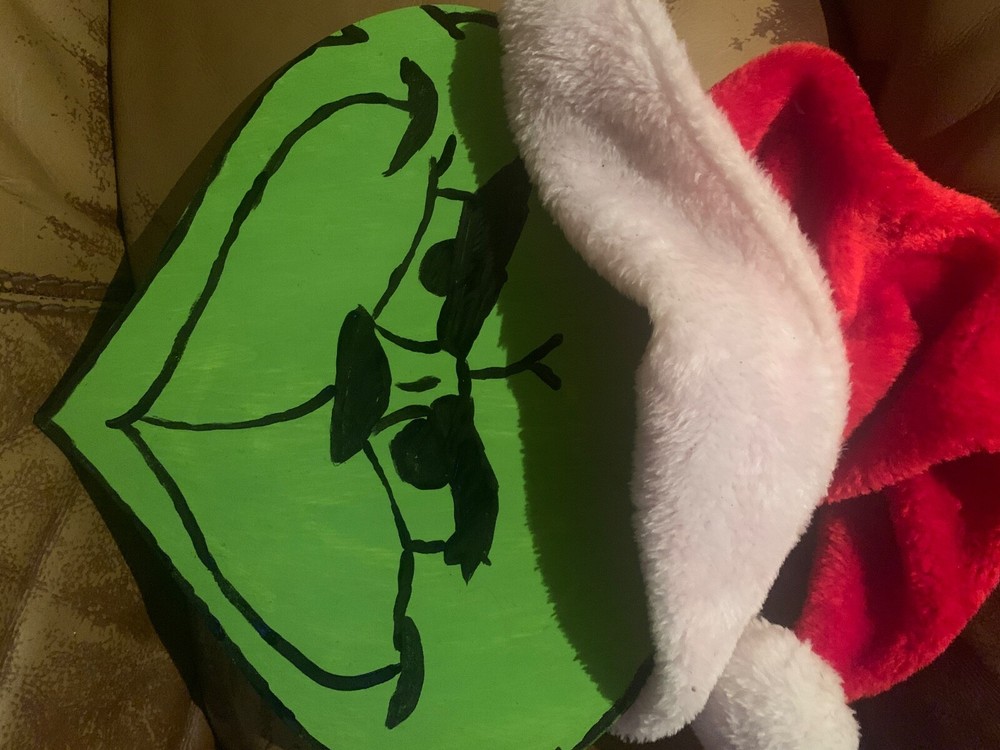 Festive wooden Grinch face holiday decor on sale for $5 post-Christmas